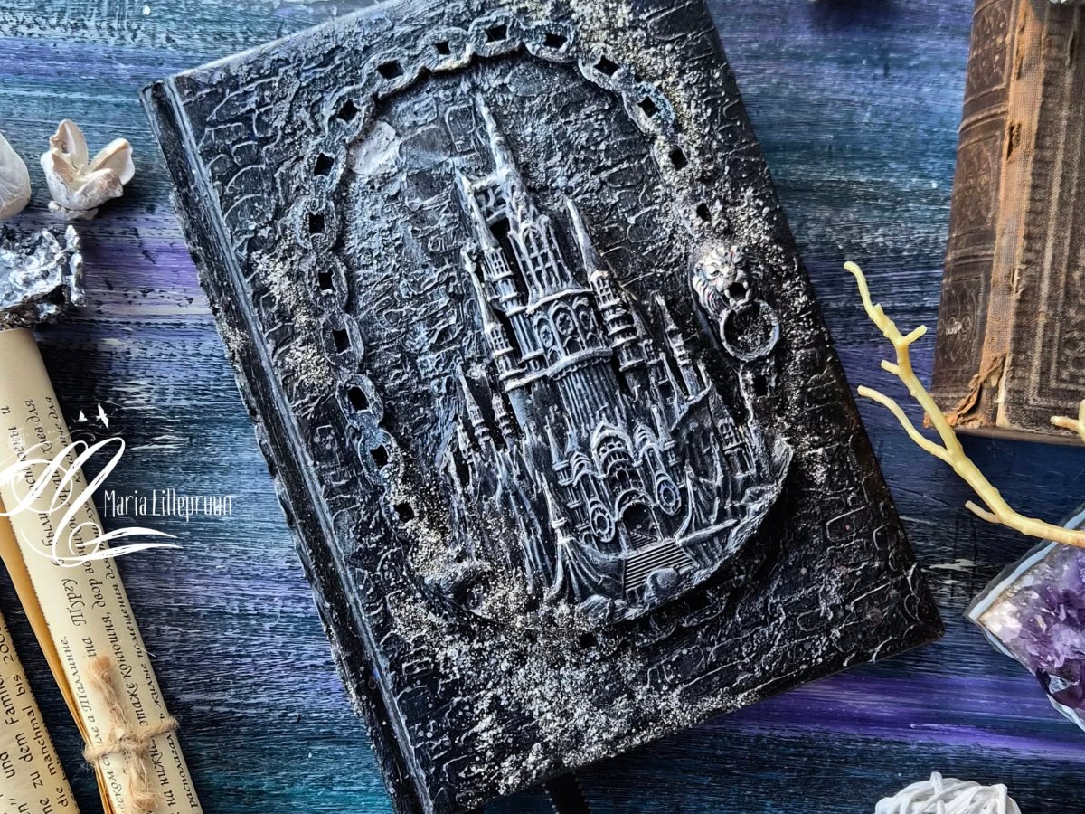 Fantasy notebook with a sculpted silver castle on the cover