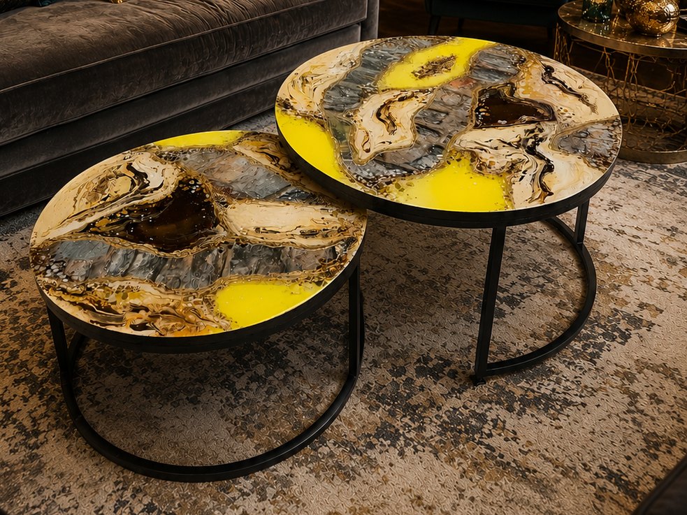 Pair of round resin coffee tables in gold, grey and yellow